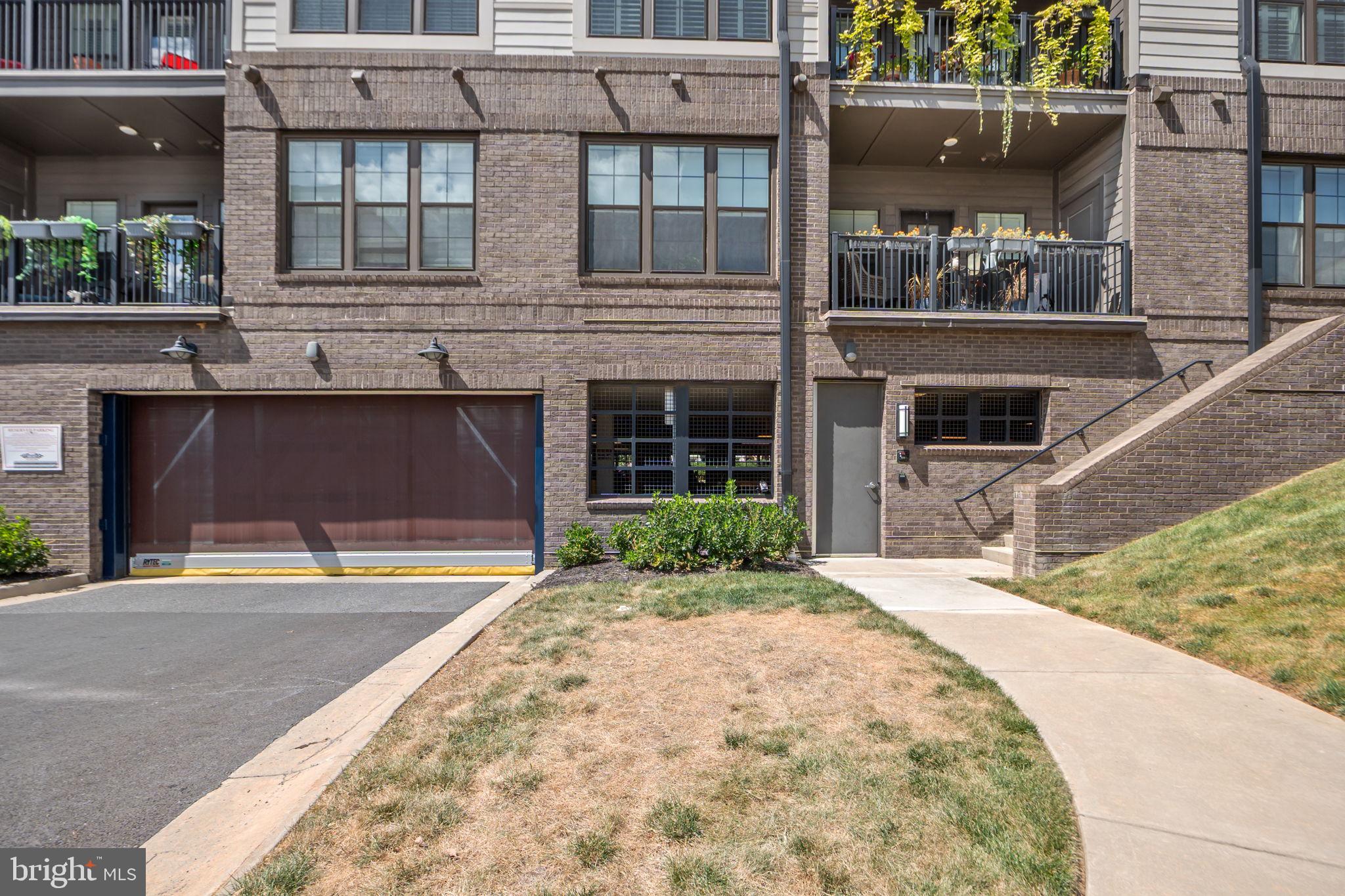 210 Decoverly Drive, Unit 106 Gaithersburg, MD 20878 - Photo 37 of 59 a front view of a house with a yard