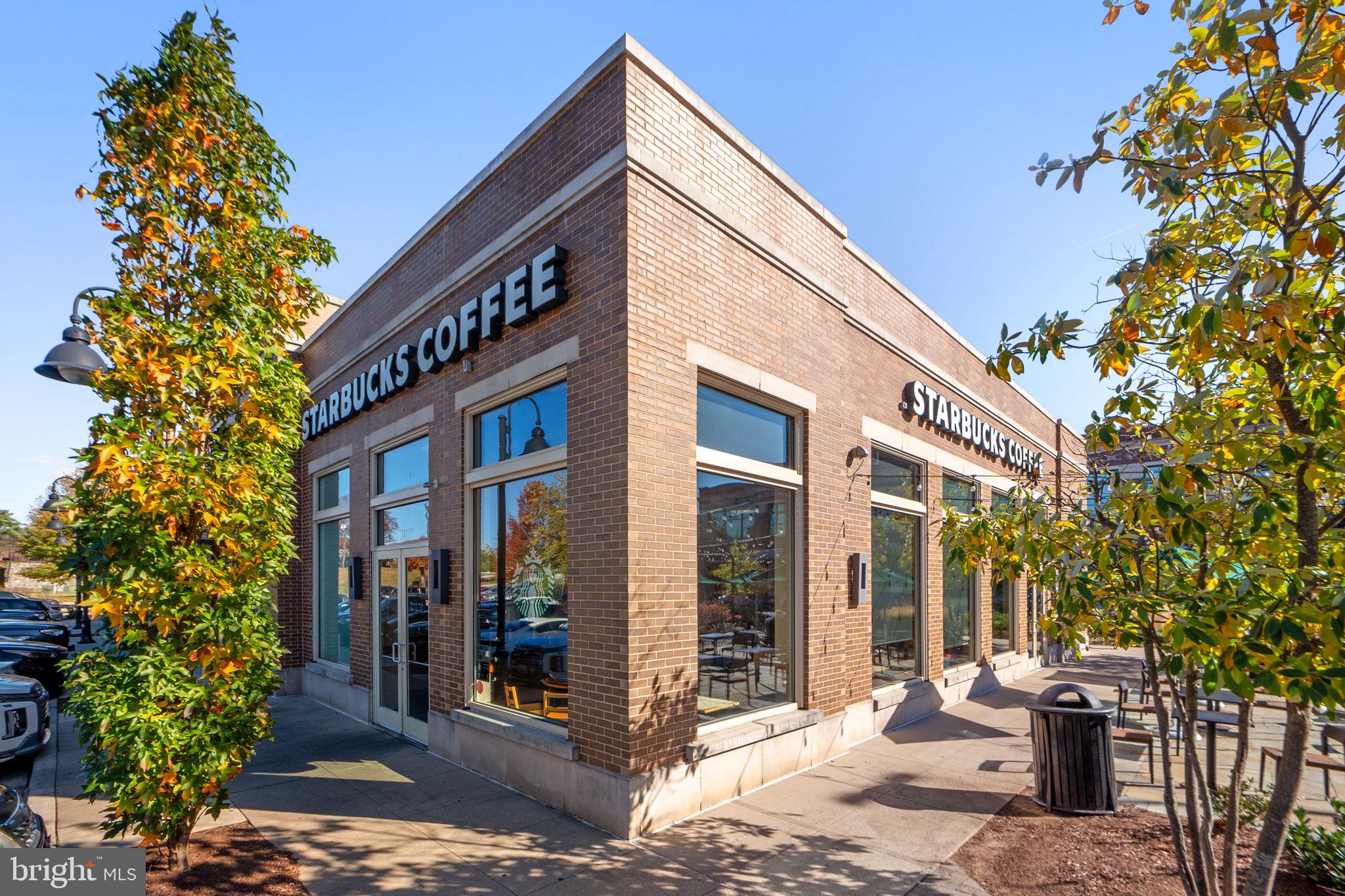 210 Decoverly Drive, Unit 106 Gaithersburg, MD 20878 - Photo 44 of 59 a view of a building with a tree