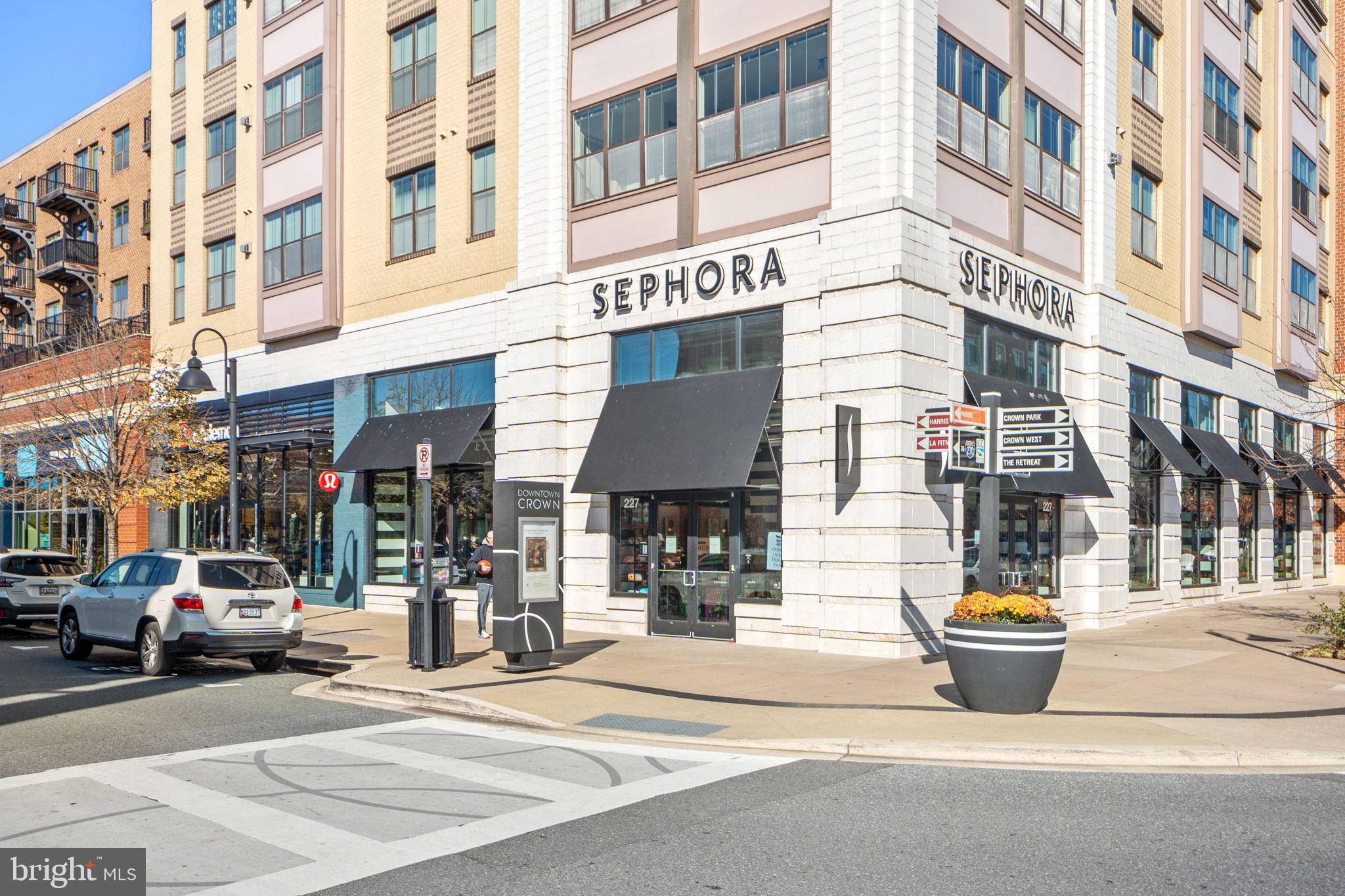 210 Decoverly Drive, Unit 106 Gaithersburg, MD 20878 - Photo 50 of 59 a view of a building and a street with cars