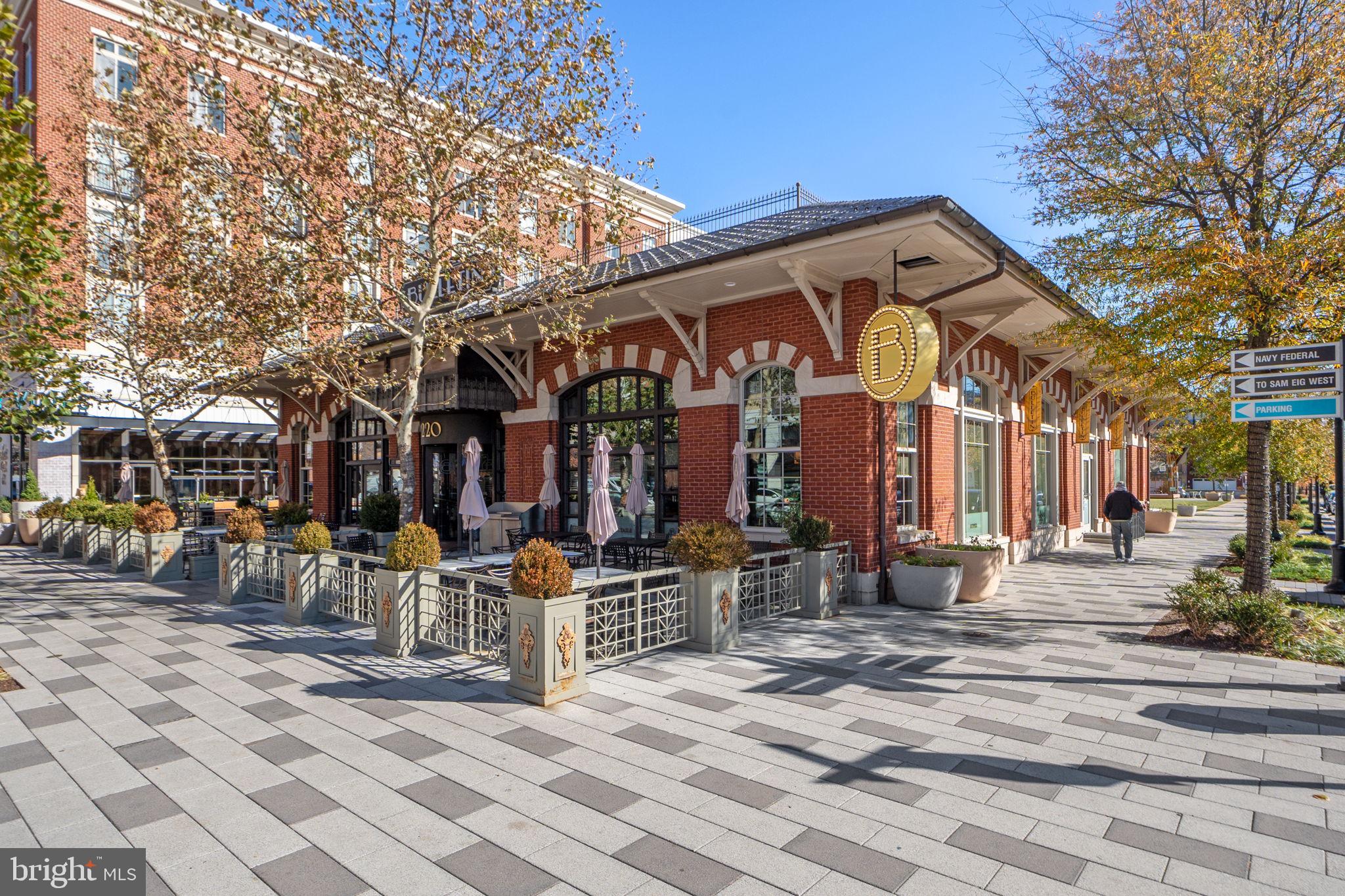 210 Decoverly Drive, Unit 106 Gaithersburg, MD 20878 - Photo 52 of 59 a view of a building with sitting area