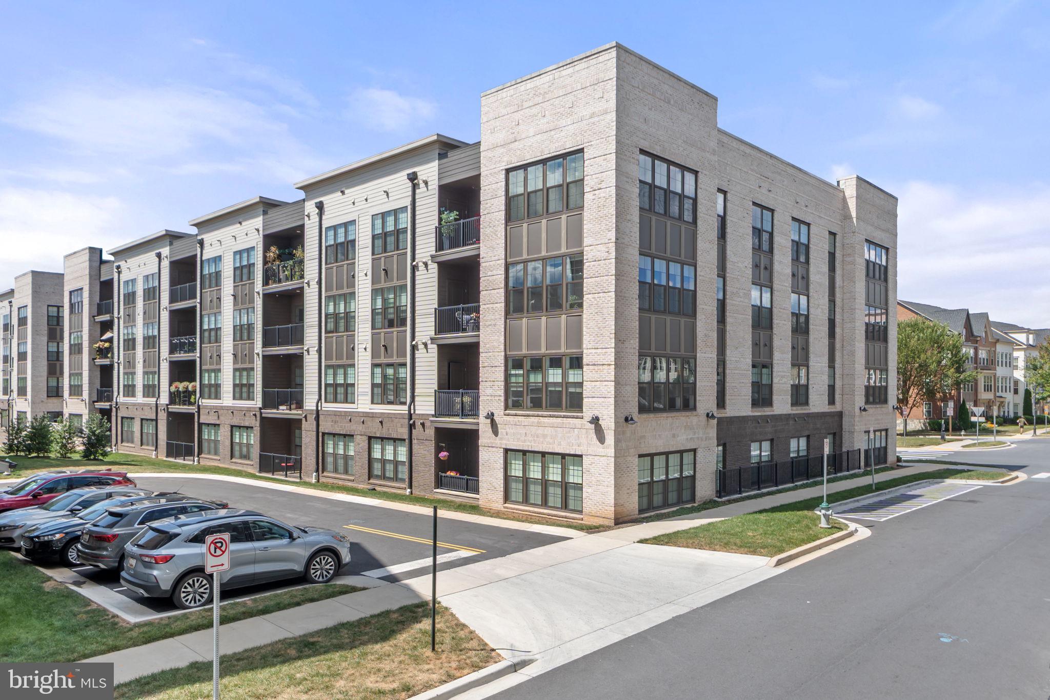 210 Decoverly Drive, Unit 106 Gaithersburg, MD 20878 - Photo 6 of 59 a car parked in front of a building