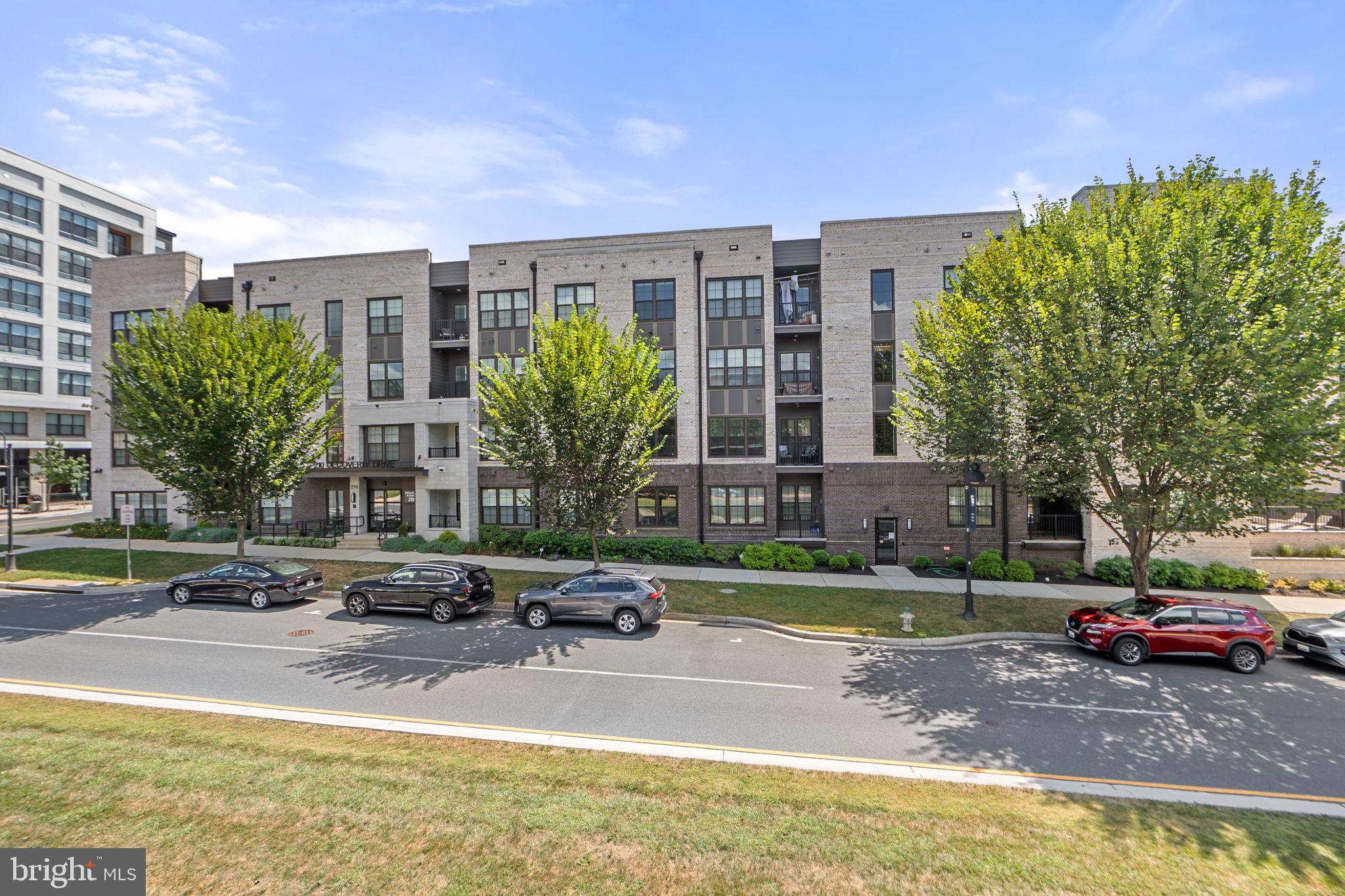 210 Decoverly Drive, Unit 106 Gaithersburg, MD 20878 - Photo 10 of 59 a view of a swimming pool with a patio