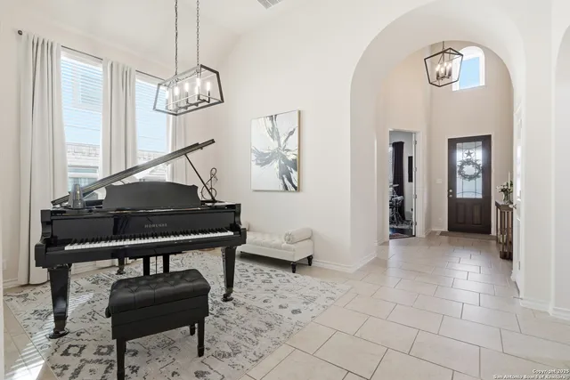 a kitchen with stainless steel appliances granite countertop a stove top oven a sink refrigerator and cabinets