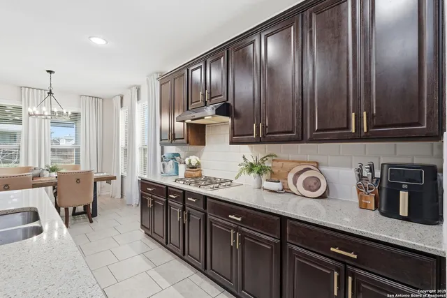 a dining room with furniture window and outside view