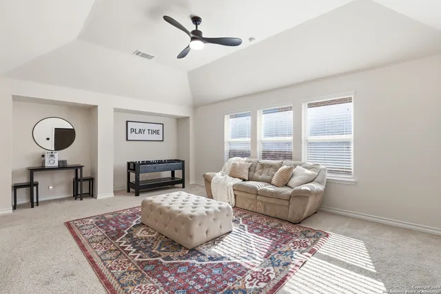 a bathroom with a sink a toilet and shower curtain