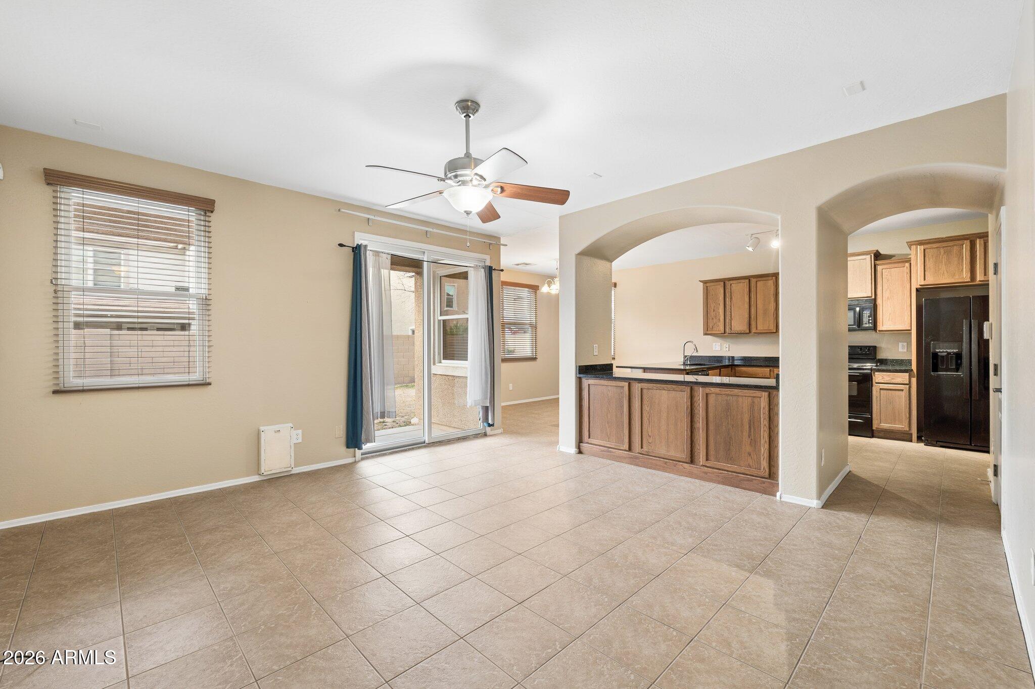 2226 East Fraktur Road Phoenix, AZ 85040 - Photo 5 of 68 Living room opens to kitchen and yard