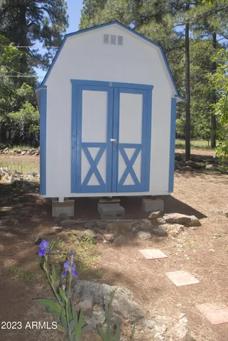 a dining room with furniture and a chandelier