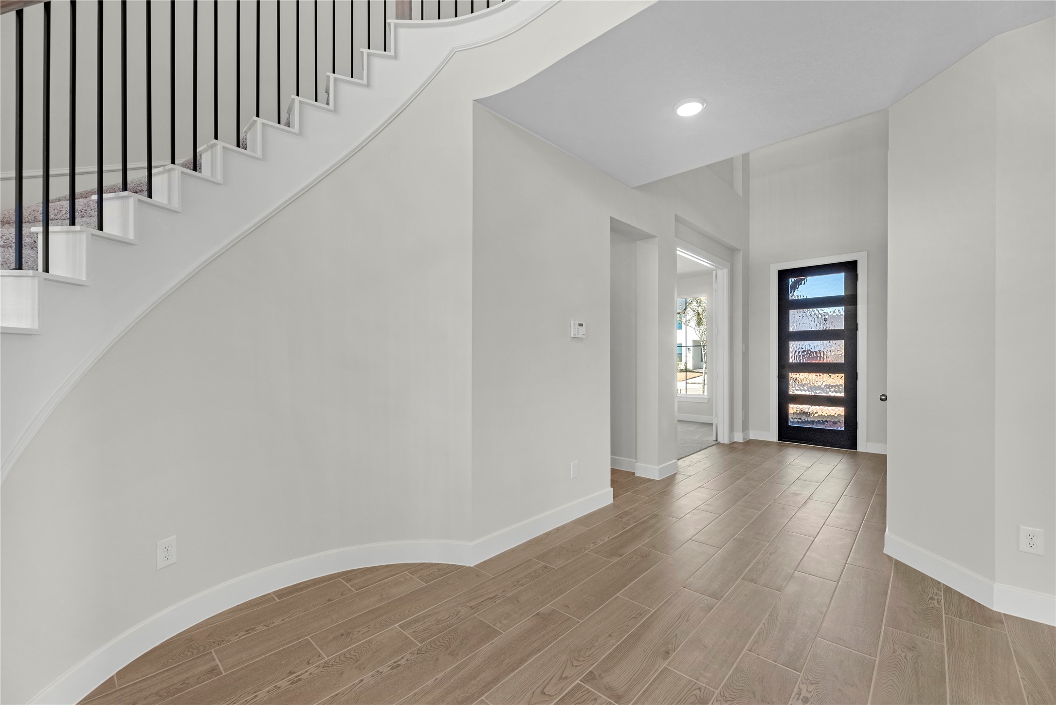 5023 Nesbit Path Rosenberg, TX 77471 - Photo 15 of 25 a view of a hallway with wooden floor and entryway