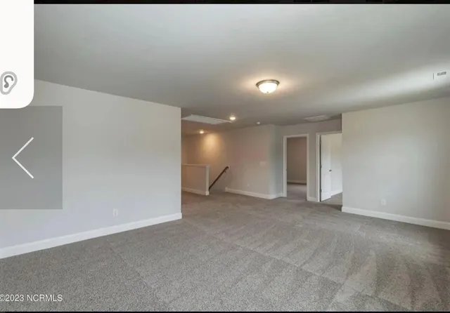 a bathroom with a bathtub shower sink vanity mirror and toilet