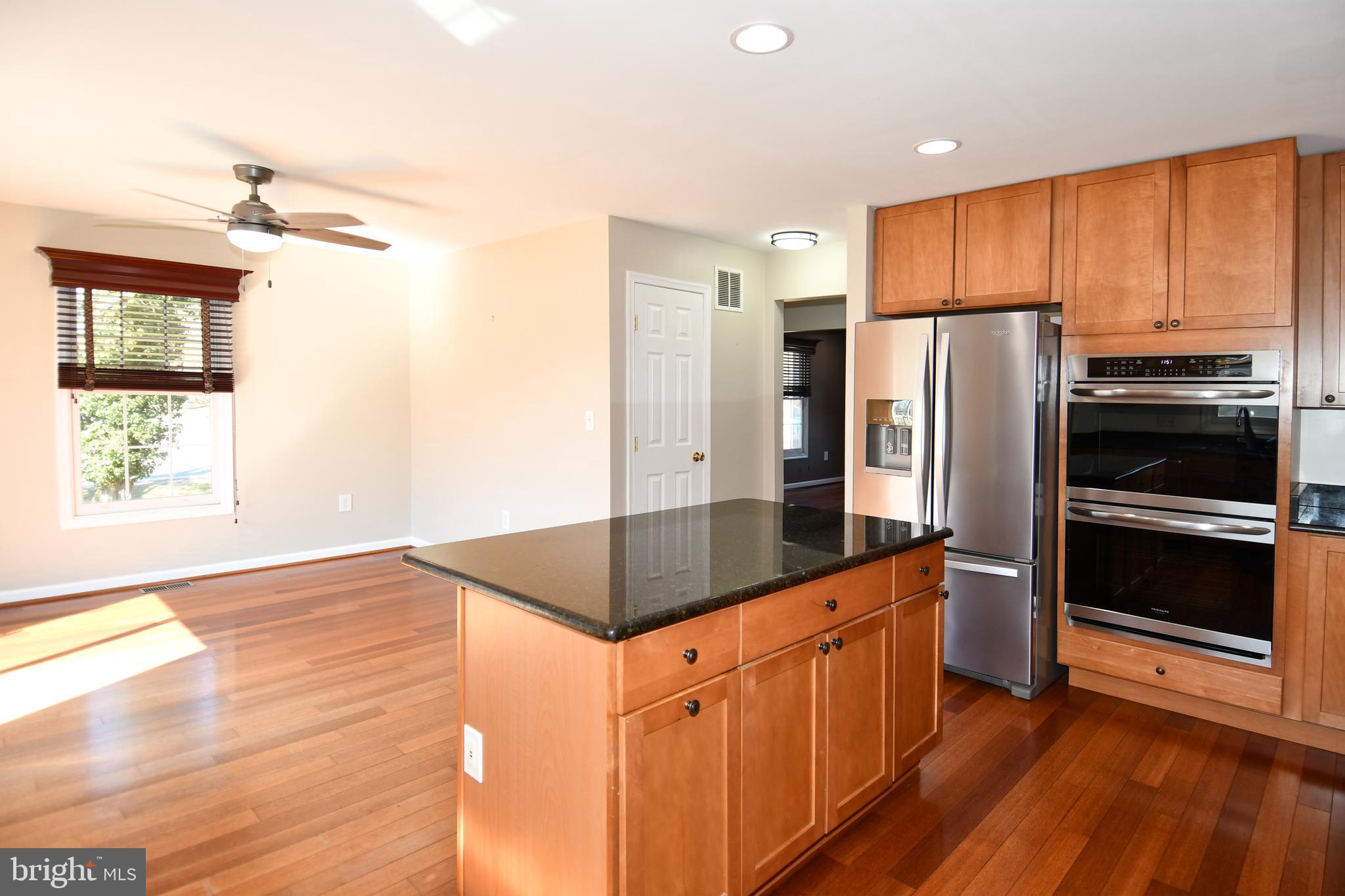 1048 Windrush Lane, Unit 39 Sandy Spring, MD 20860 - Photo 13 of 39 a kitchen with stainless steel appliances a refrigerator and a stove top oven