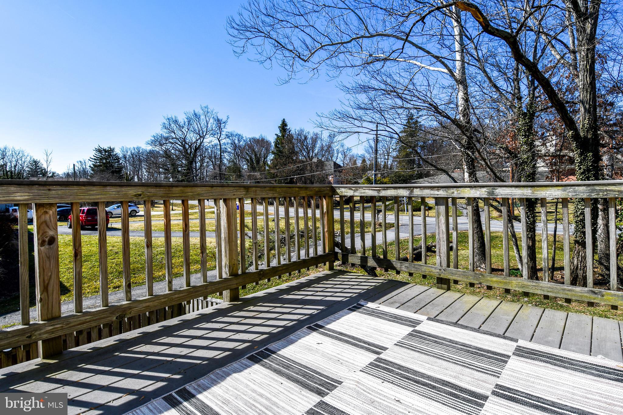 1048 Windrush Lane, Unit 39 Sandy Spring, MD 20860 - Photo 16 of 39 a view of balcony with wooden floor and fence