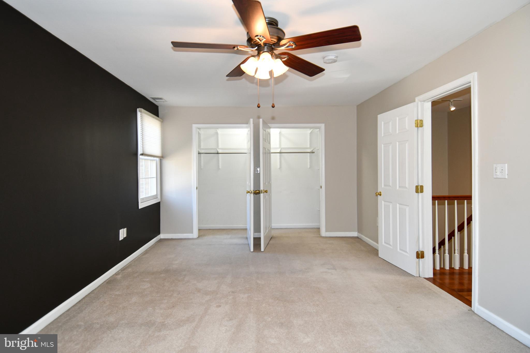 1048 Windrush Lane, Unit 39 Sandy Spring, MD 20860 - Photo 19 of 39 wooden floor in an empty room with a window
