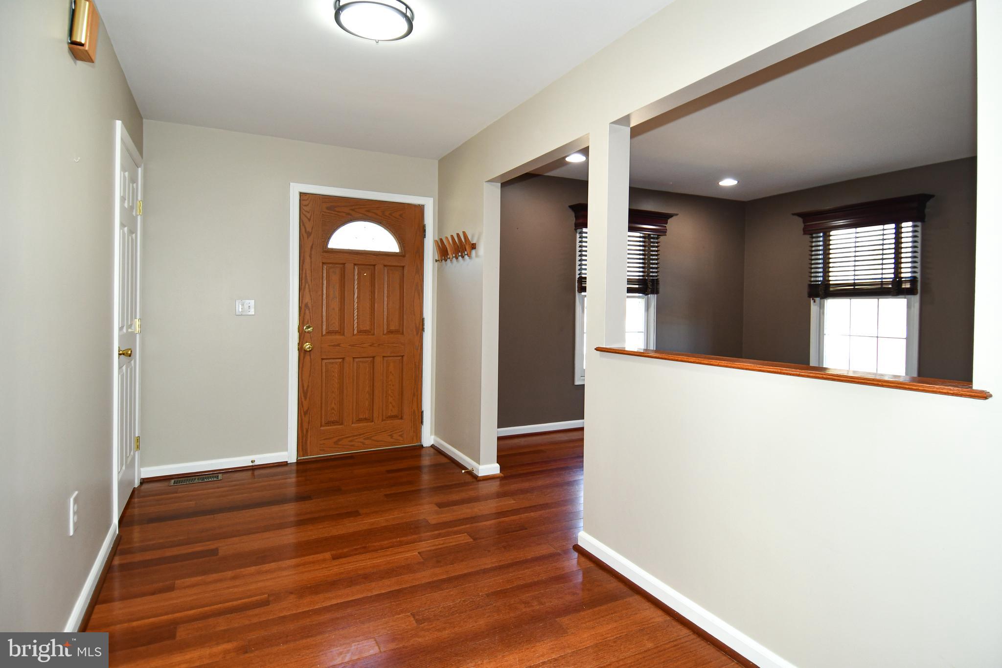 1048 Windrush Lane, Unit 39 Sandy Spring, MD 20860 - Photo 2 of 39 a view of a room with wooden floor and window