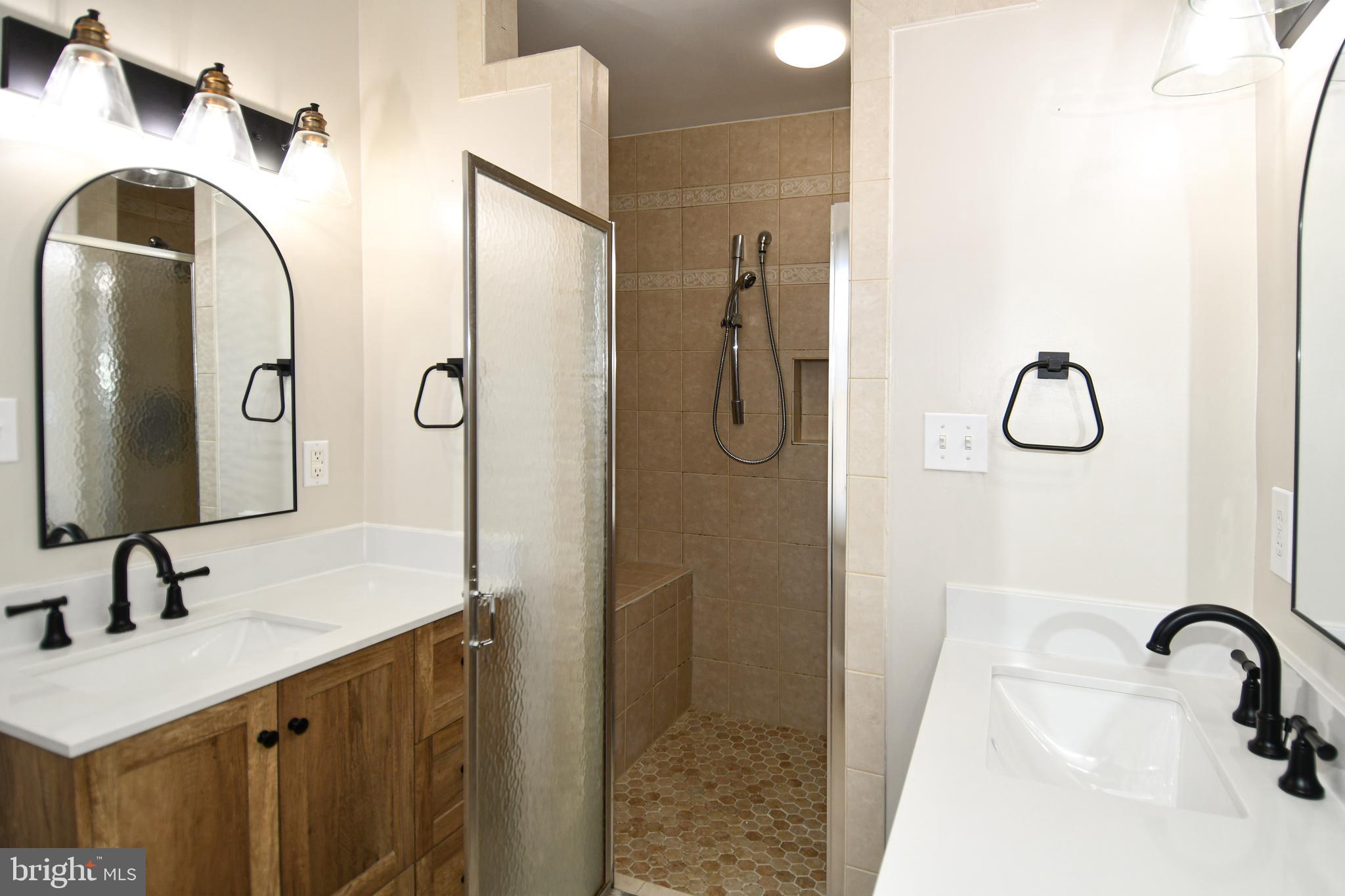 1048 Windrush Lane, Unit 39 Sandy Spring, MD 20860 - Photo 23 of 39 a bathroom with a sink and a mirror