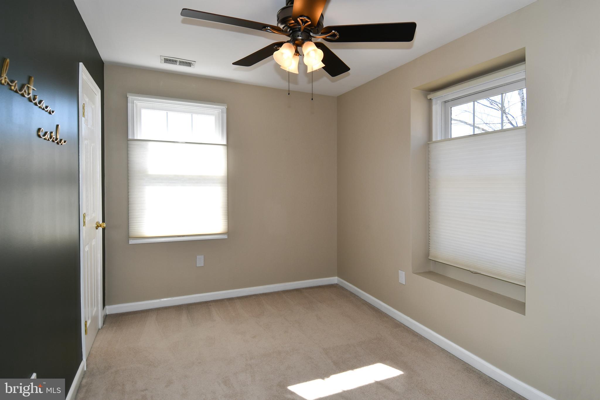 1048 Windrush Lane, Unit 39 Sandy Spring, MD 20860 - Photo 24 of 39 a view of an empty room with a window