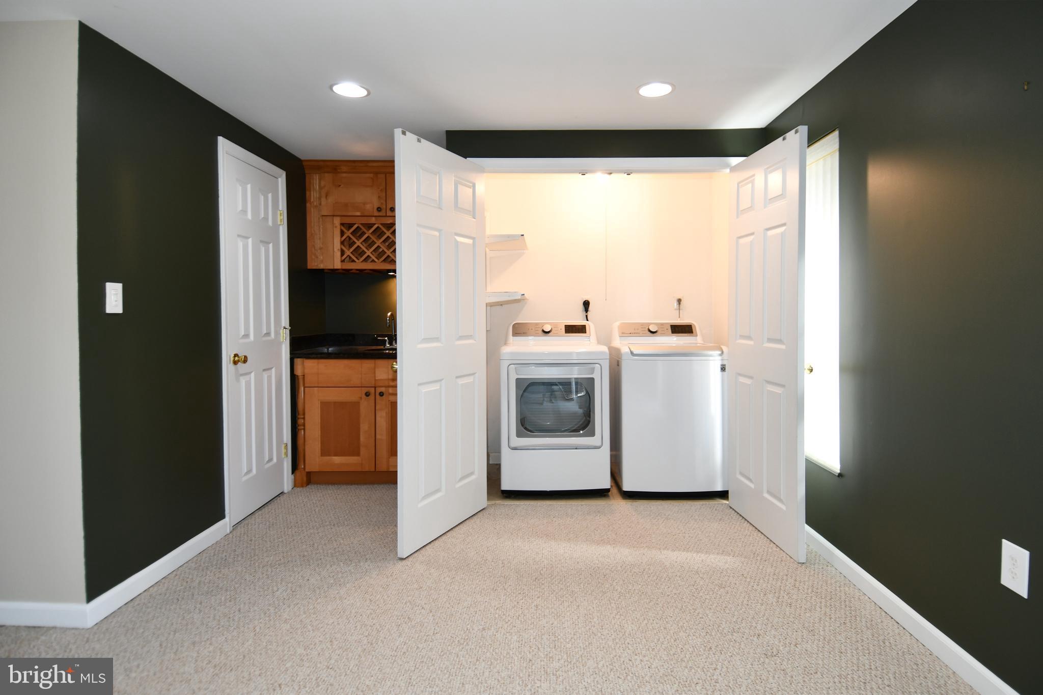 1048 Windrush Lane, Unit 39 Sandy Spring, MD 20860 - Photo 30 of 39 a view of a kitchen with refrigerator and window