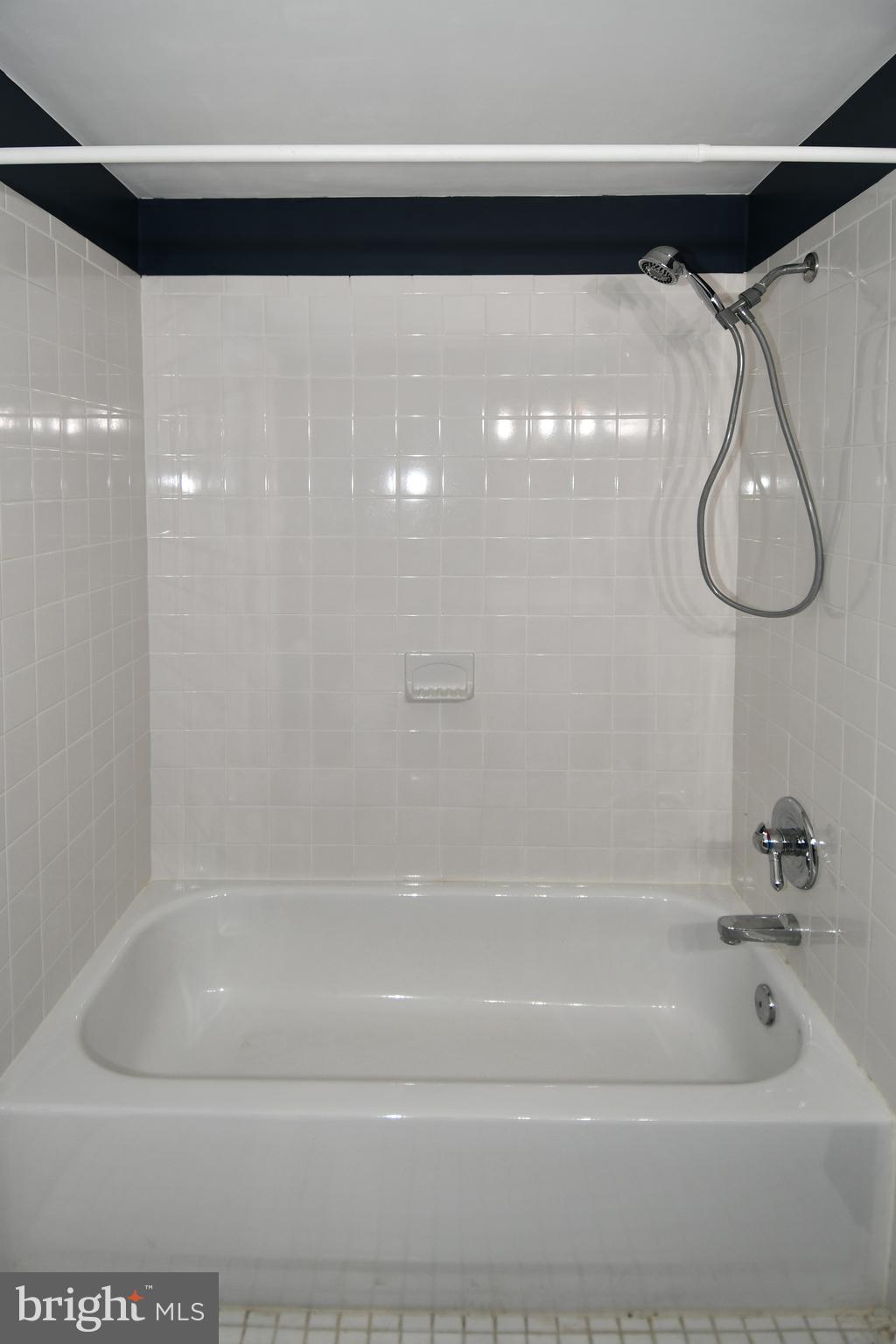 1048 Windrush Lane, Unit 39 Sandy Spring, MD 20860 - Photo 33 of 39 a close up of a bathtub in a bathroom