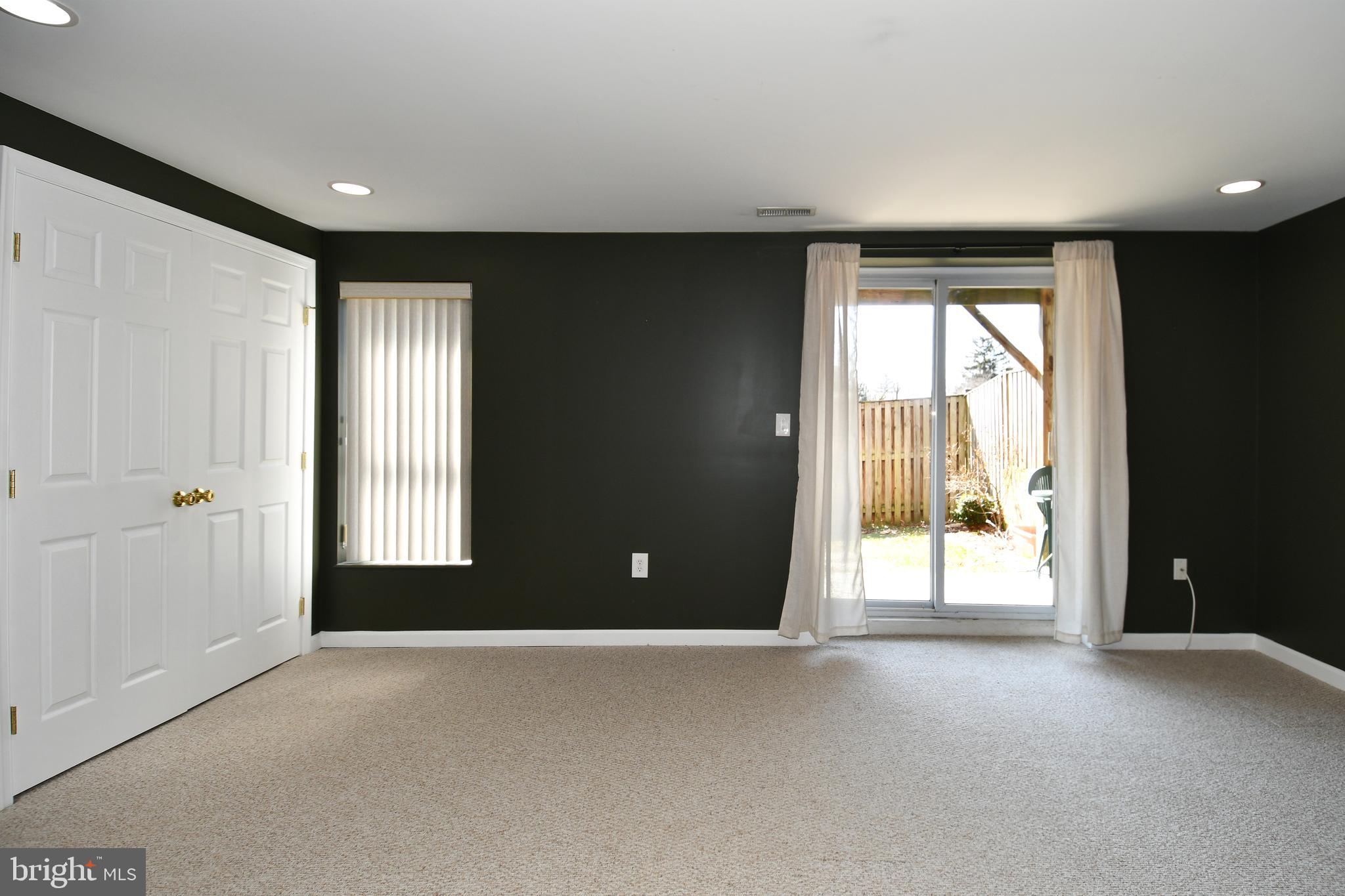 1048 Windrush Lane, Unit 39 Sandy Spring, MD 20860 - Photo 34 of 39 a view of an empty room with a window