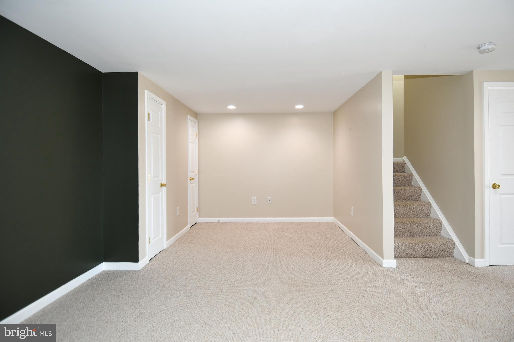 1048 Windrush Lane, Unit 39 Sandy Spring, MD 20860 - Photo 36 of 39 a view of an empty room with stairs