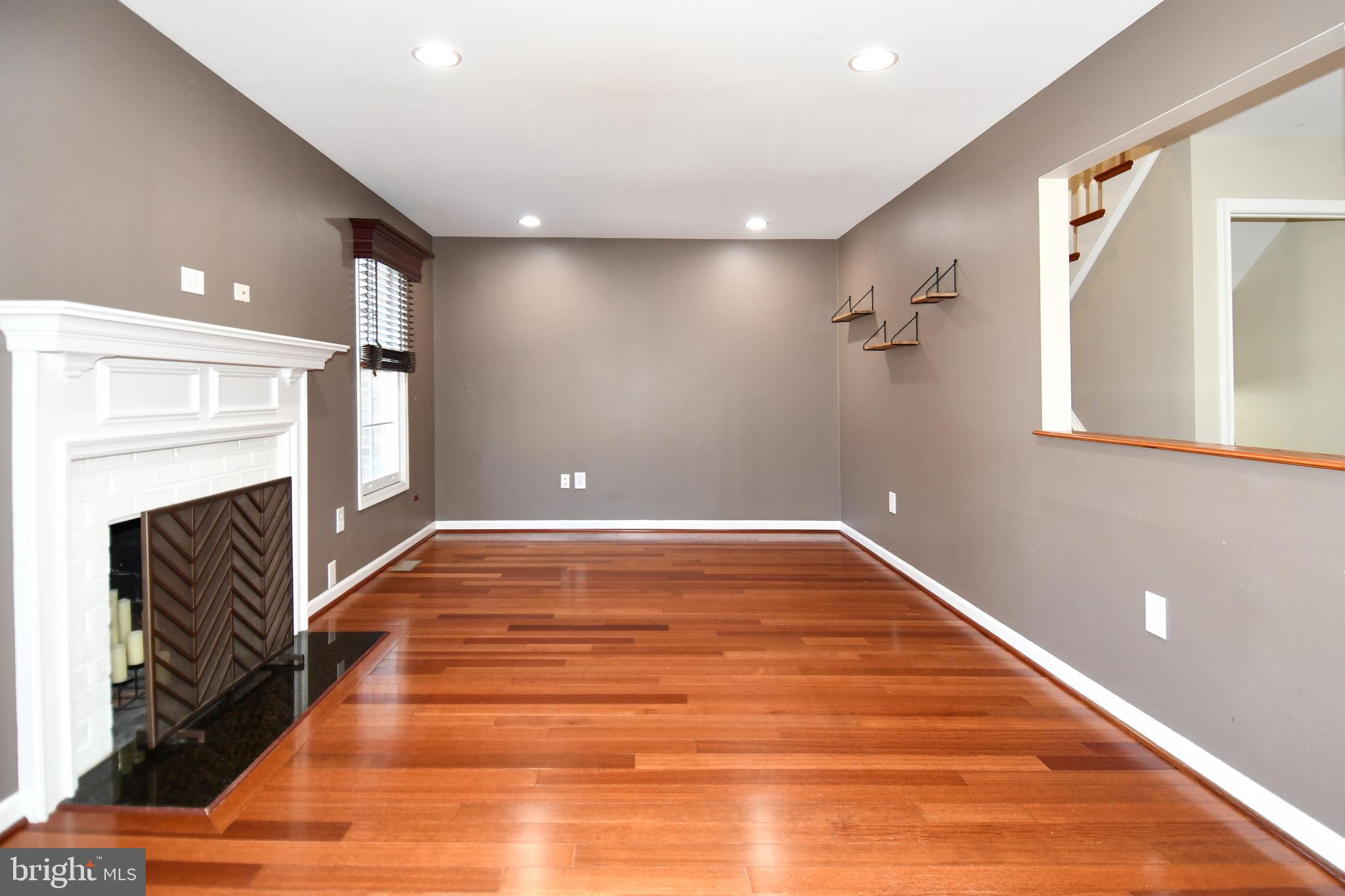 1048 Windrush Lane, Unit 39 Sandy Spring, MD 20860 - Photo 5 of 39 a view of an empty room with wooden floor