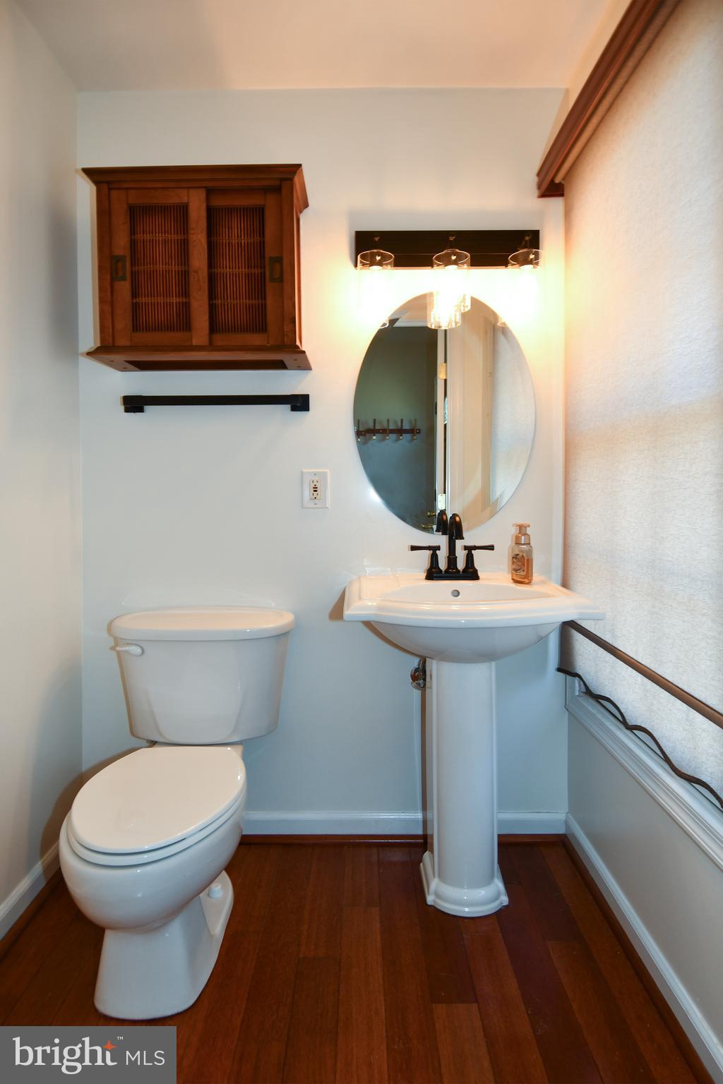 1048 Windrush Lane, Unit 39 Sandy Spring, MD 20860 - Photo 8 of 39 a bathroom with a sink toilet and mirror