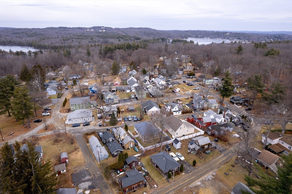 43 Trinity Avenue Sterling, MA 01564 - Photo 12 of 18 an aerial view of a city with lots of residential buildings and mountain view in back