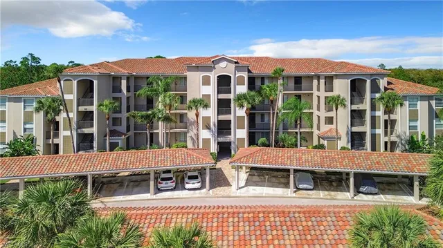 a view of large building with a window and balcony