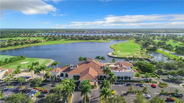 a view of a patio with couches under an umbrella
