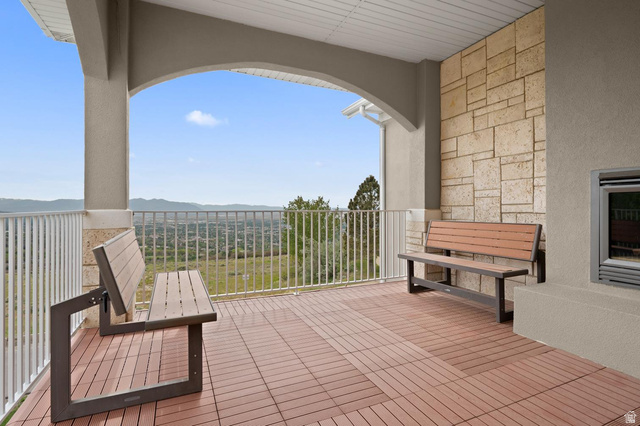 708 Eagle Rdg Drive Bountiful, UT 84010 - Photo 18 of 69 Expansive outdoor patio featuring a patterned tile floor and white railing