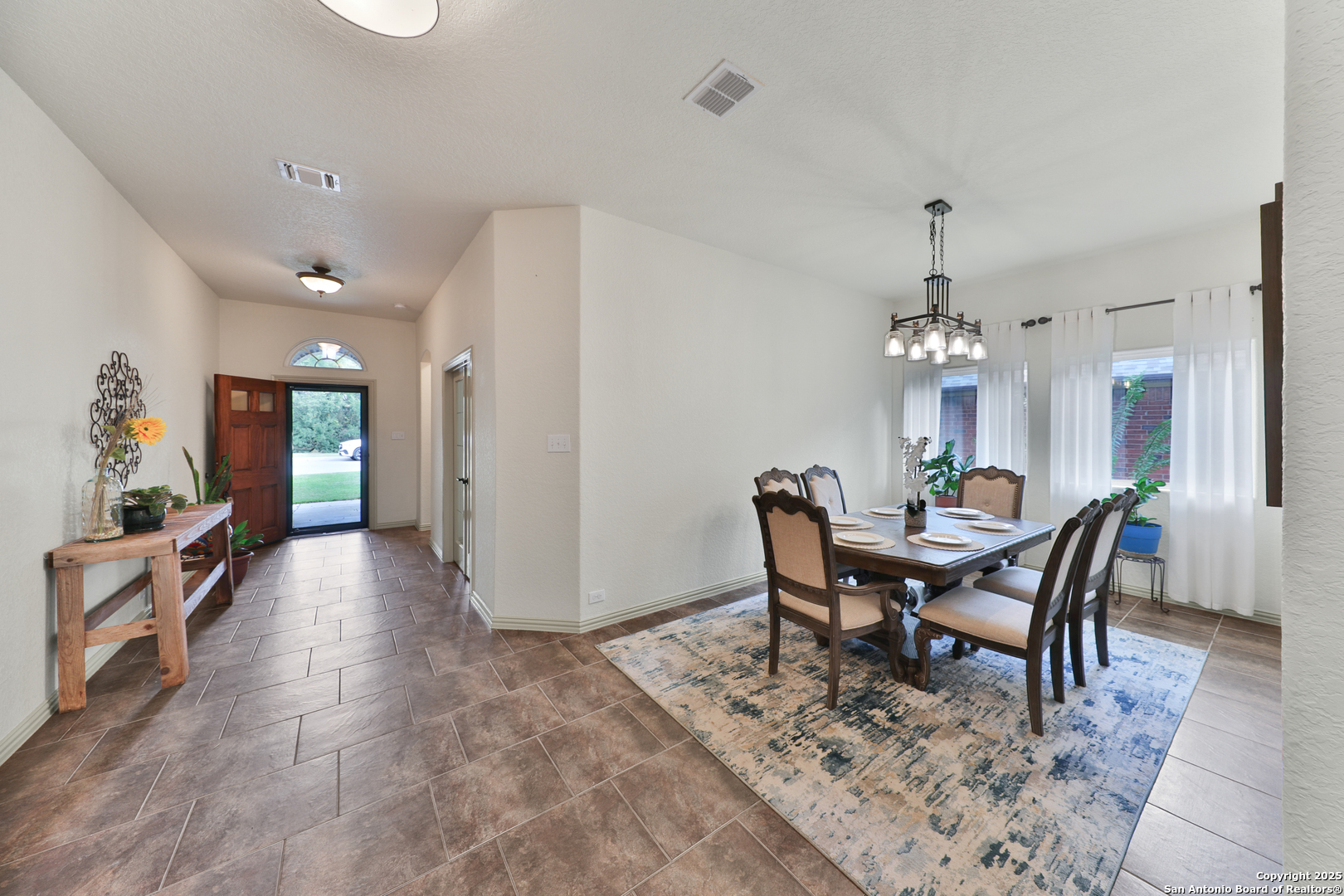 10811 Newcroft Place Helotes, TX 78023 - Photo 14 of 52 a view of a dining room with furniture