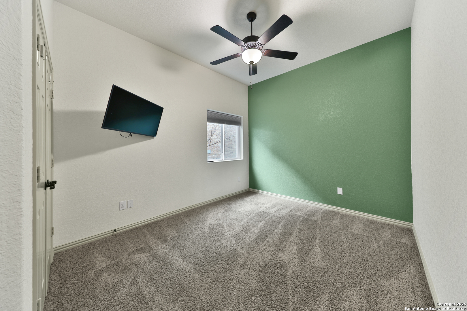 10811 Newcroft Place Helotes, TX 78023 - Photo 18 of 52 a view of a livingroom with a flat screen tv