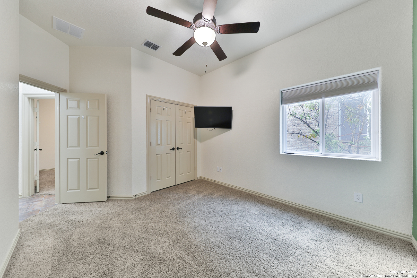 10811 Newcroft Place Helotes, TX 78023 - Photo 19 of 52 a view of an empty room with a window
