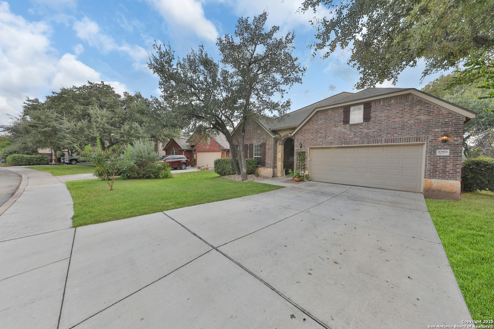 10811 Newcroft Place Helotes, TX 78023 - Photo 2 of 52 a front view of a house with yard