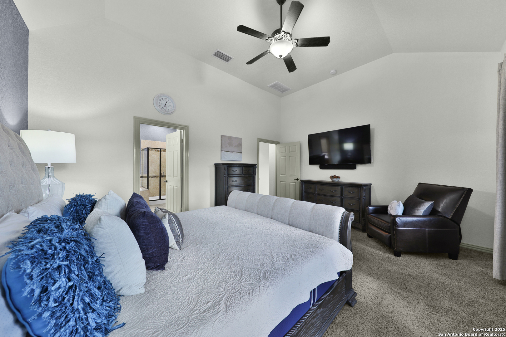 10811 Newcroft Place Helotes, TX 78023 - Photo 23 of 52 a bedroom with a bed and a flat screen tv