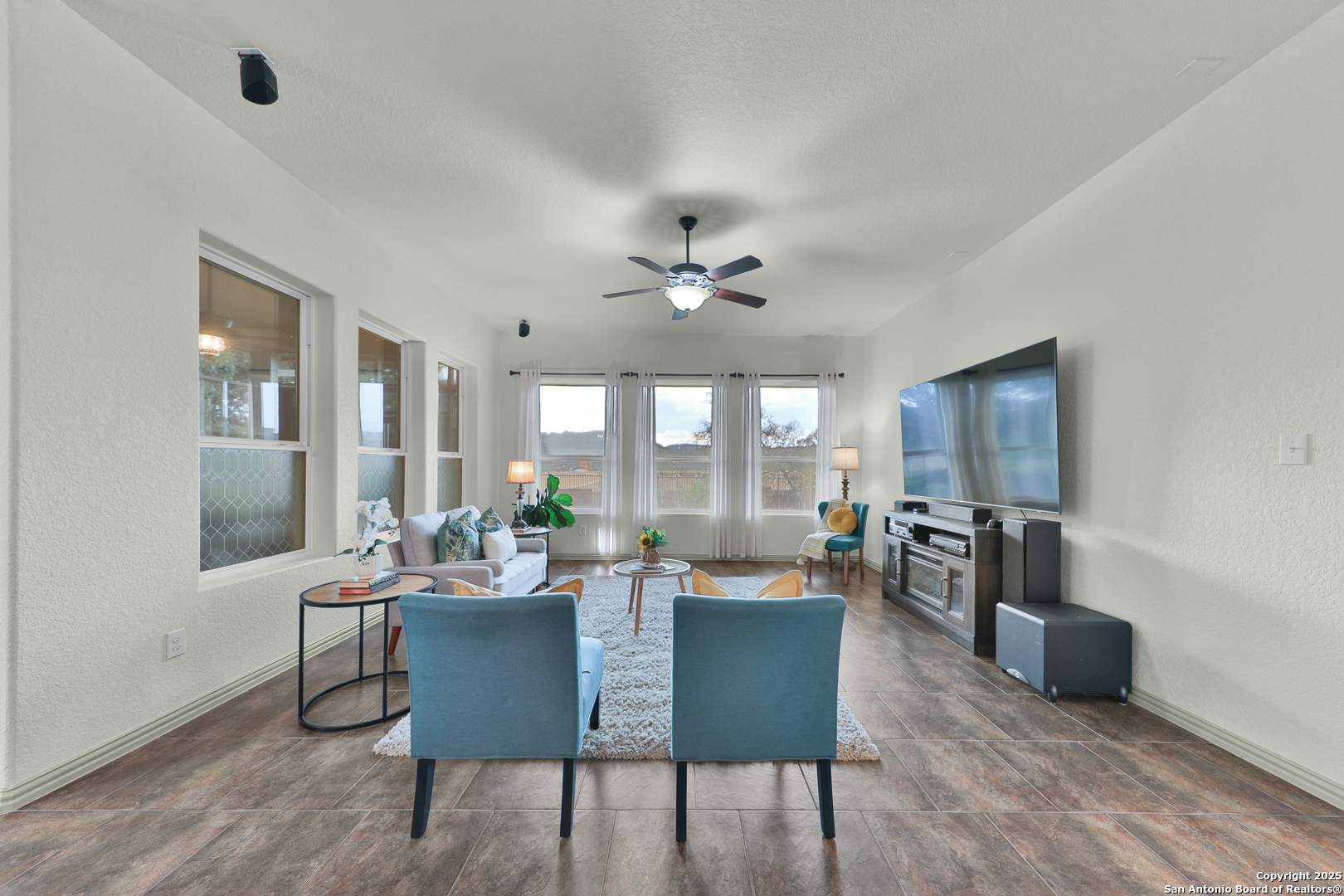 10811 Newcroft Place Helotes, TX 78023 - Photo 27 of 52 a dining room with furniture a rug and wooden floor
