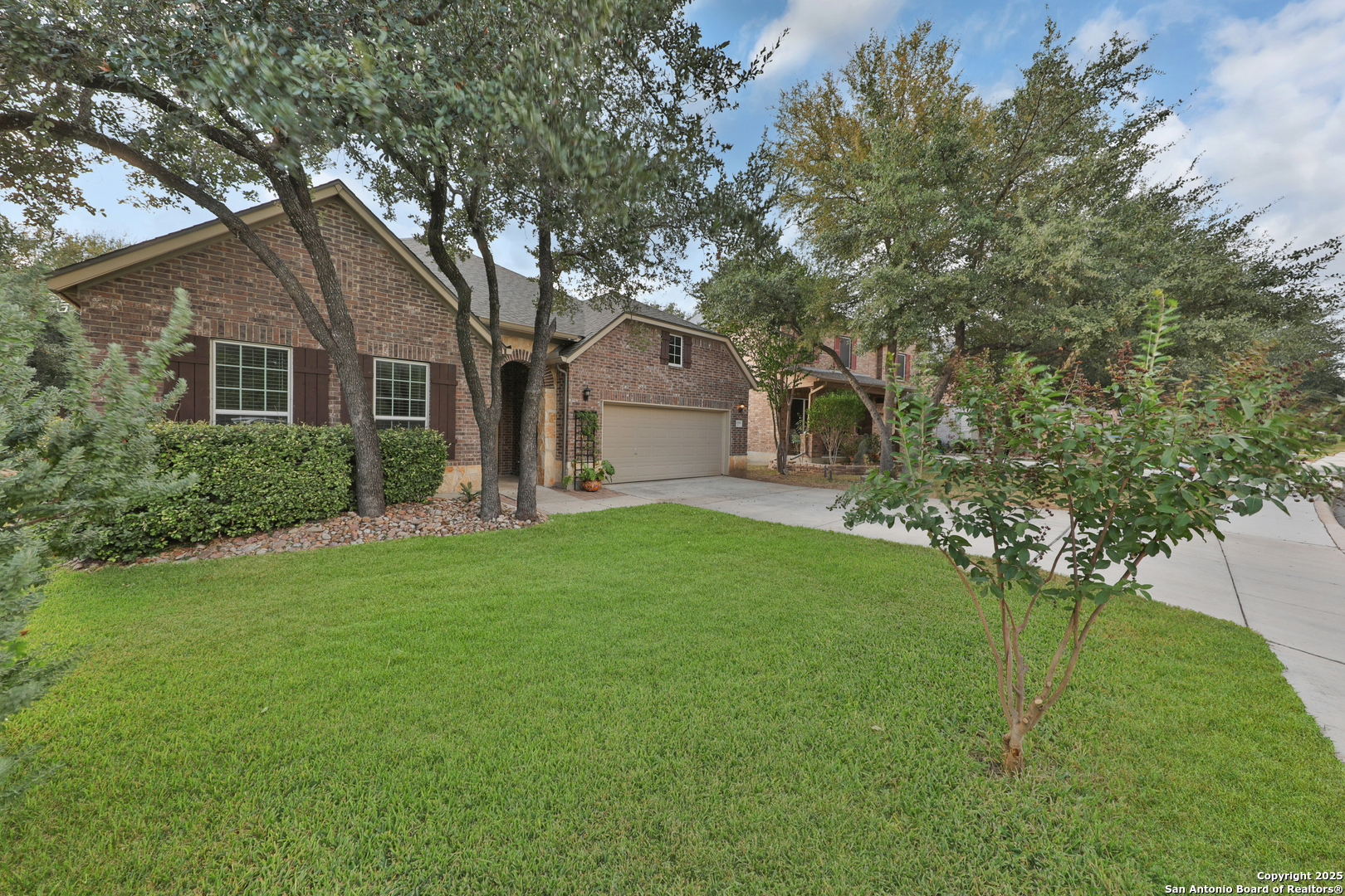 10811 Newcroft Place Helotes, TX 78023 - Photo 3 of 52 a front view of house with yard and green space