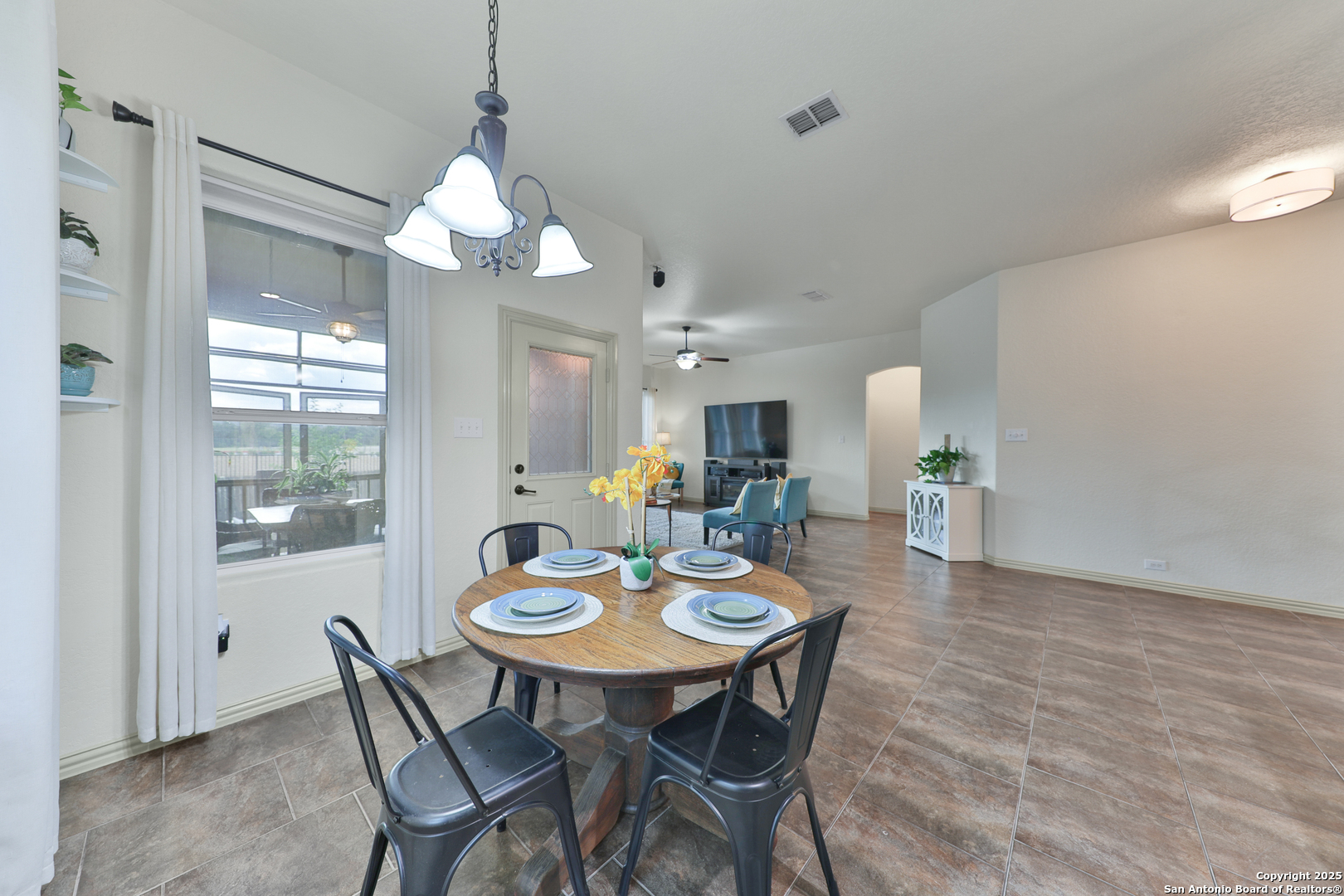 10811 Newcroft Place Helotes, TX 78023 - Photo 32 of 52 a view of a dining room with furniture and window