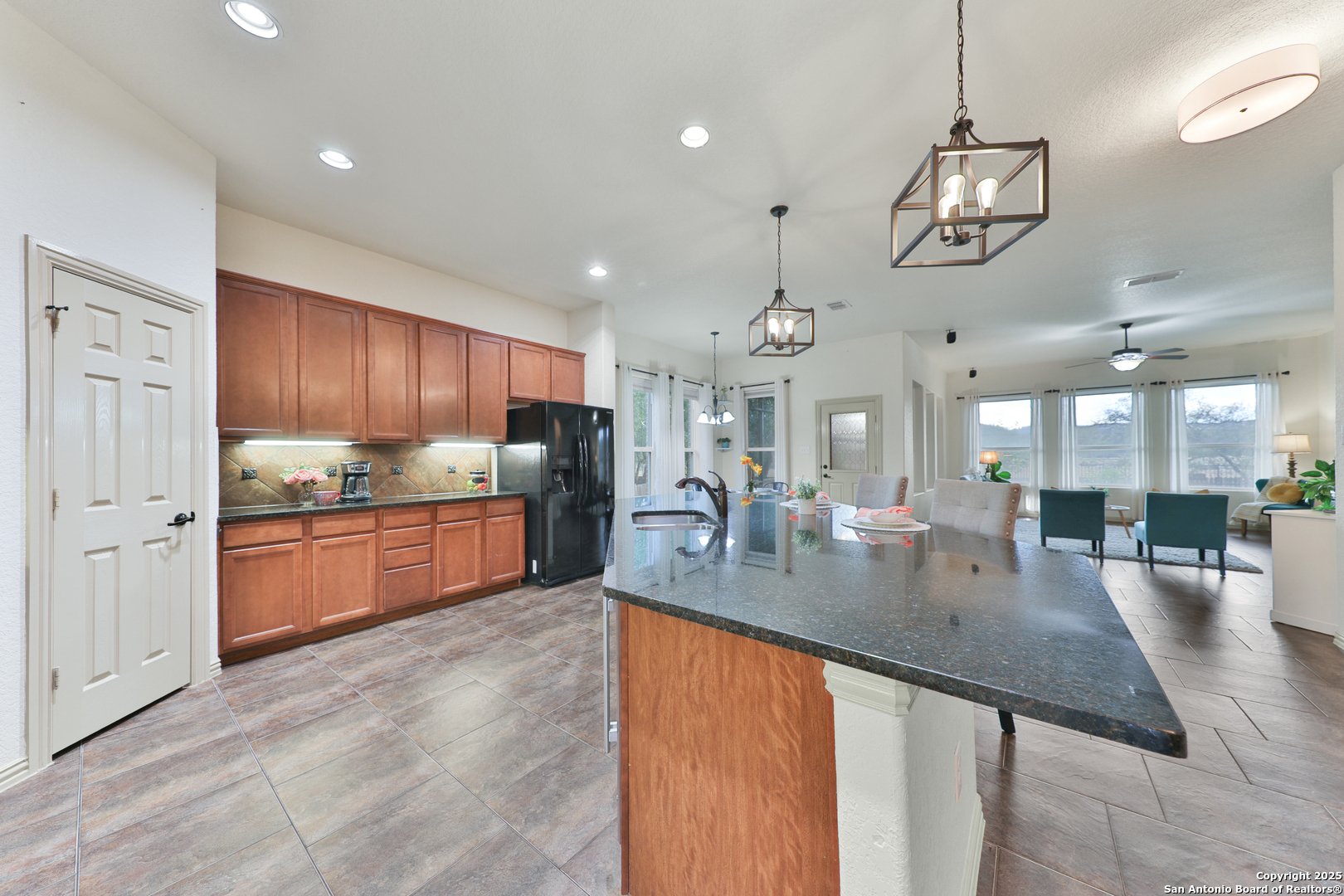 10811 Newcroft Place Helotes, TX 78023 - Photo 35 of 52 a large kitchen with stainless steel appliances lots of counter space and breakfast area