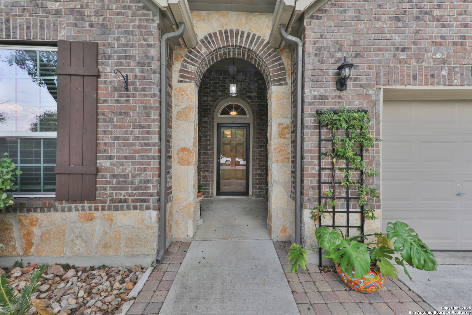 10811 Newcroft Place Helotes, TX 78023 - Photo 4 of 52 a view of a entryway door of the house