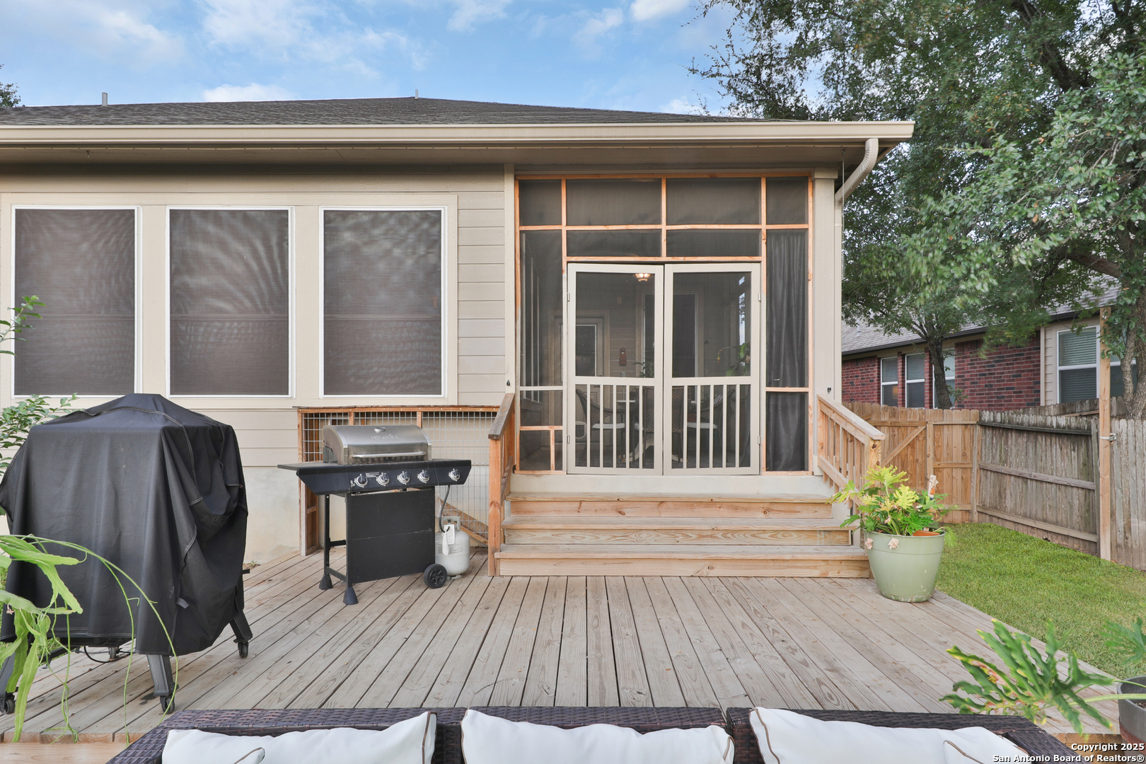 10811 Newcroft Place Helotes, TX 78023 - Photo 45 of 52 a view of a house with a yard and wooden floor