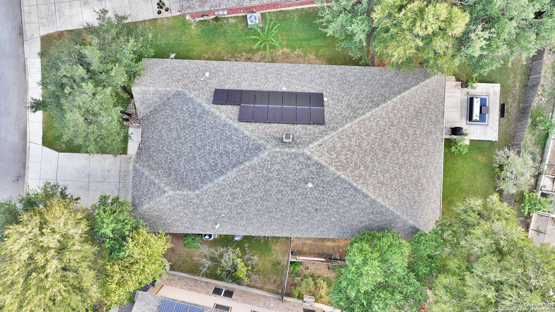 10811 Newcroft Place Helotes, TX 78023 - Photo 51 of 52 an aerial view of a house with a yard and plants