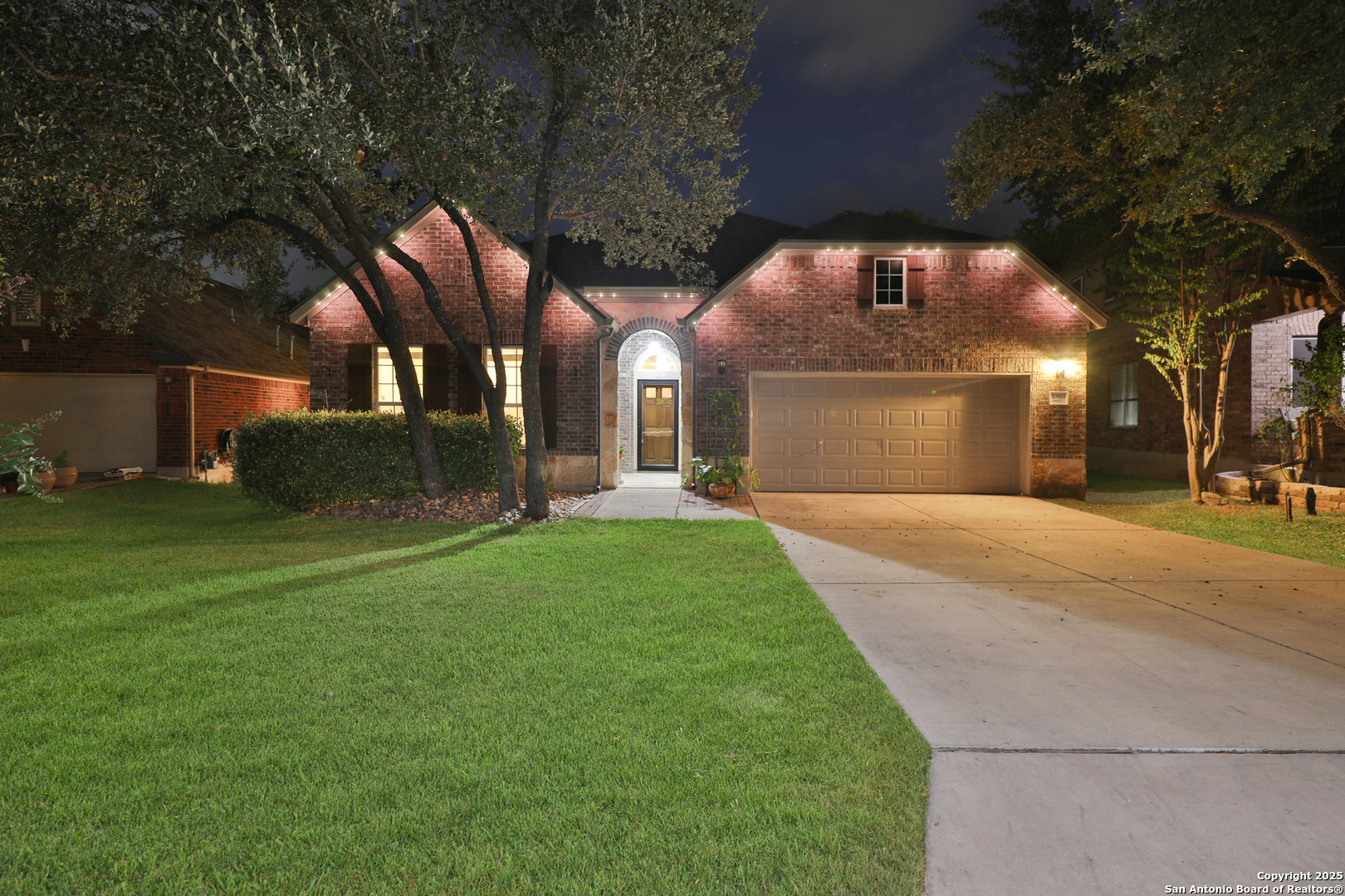 10811 Newcroft Place Helotes, TX 78023 - Photo 52 of 52 a front view of a house with a yard and trees