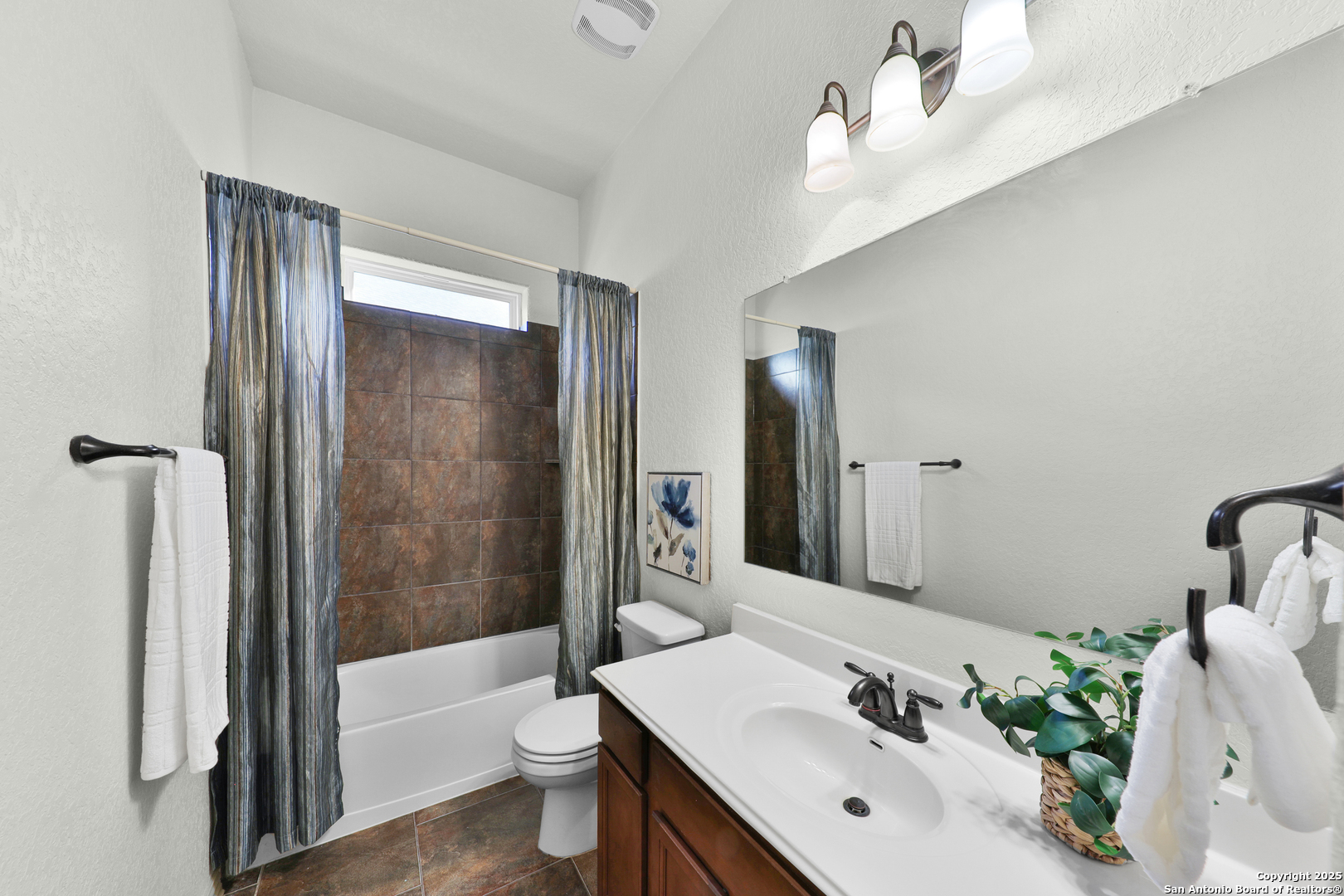 10811 Newcroft Place Helotes, TX 78023 - Photo 7 of 52 a bathroom with a sink toilet and shower