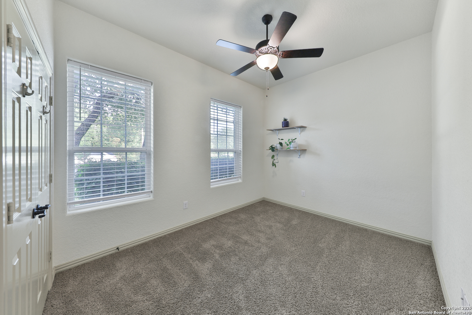 10811 Newcroft Place Helotes, TX 78023 - Photo 8 of 52 a view of an empty room with a window