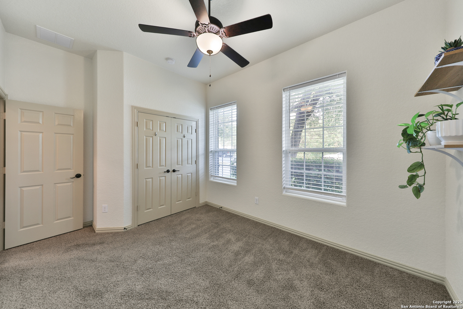 10811 Newcroft Place Helotes, TX 78023 - Photo 9 of 52 a view of an empty room with a window