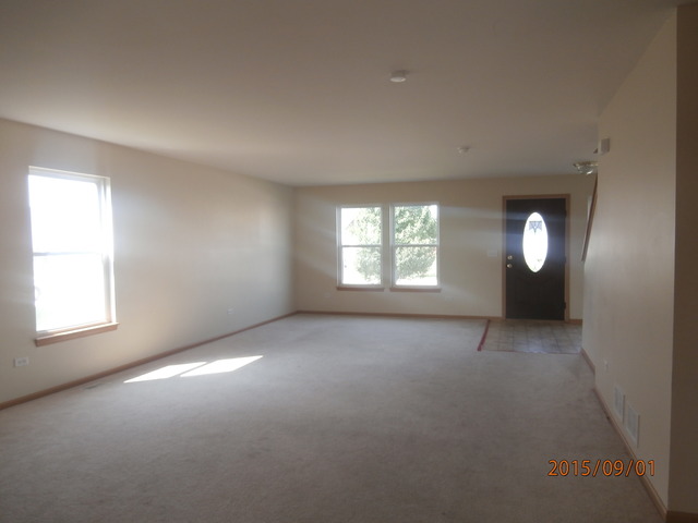 640 Halfway Road Bourbonnais, IL 60914 - Photo 5 of 15 an empty room with windows and closet