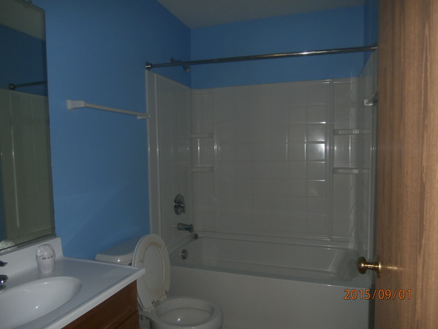 640 Halfway Road Bourbonnais, IL 60914 - Photo 8 of 15 a bathroom with a granite countertop bathtub shower sink vanity and toilet