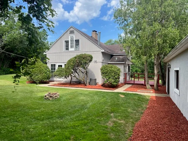 a front view of a house with a yard and porch