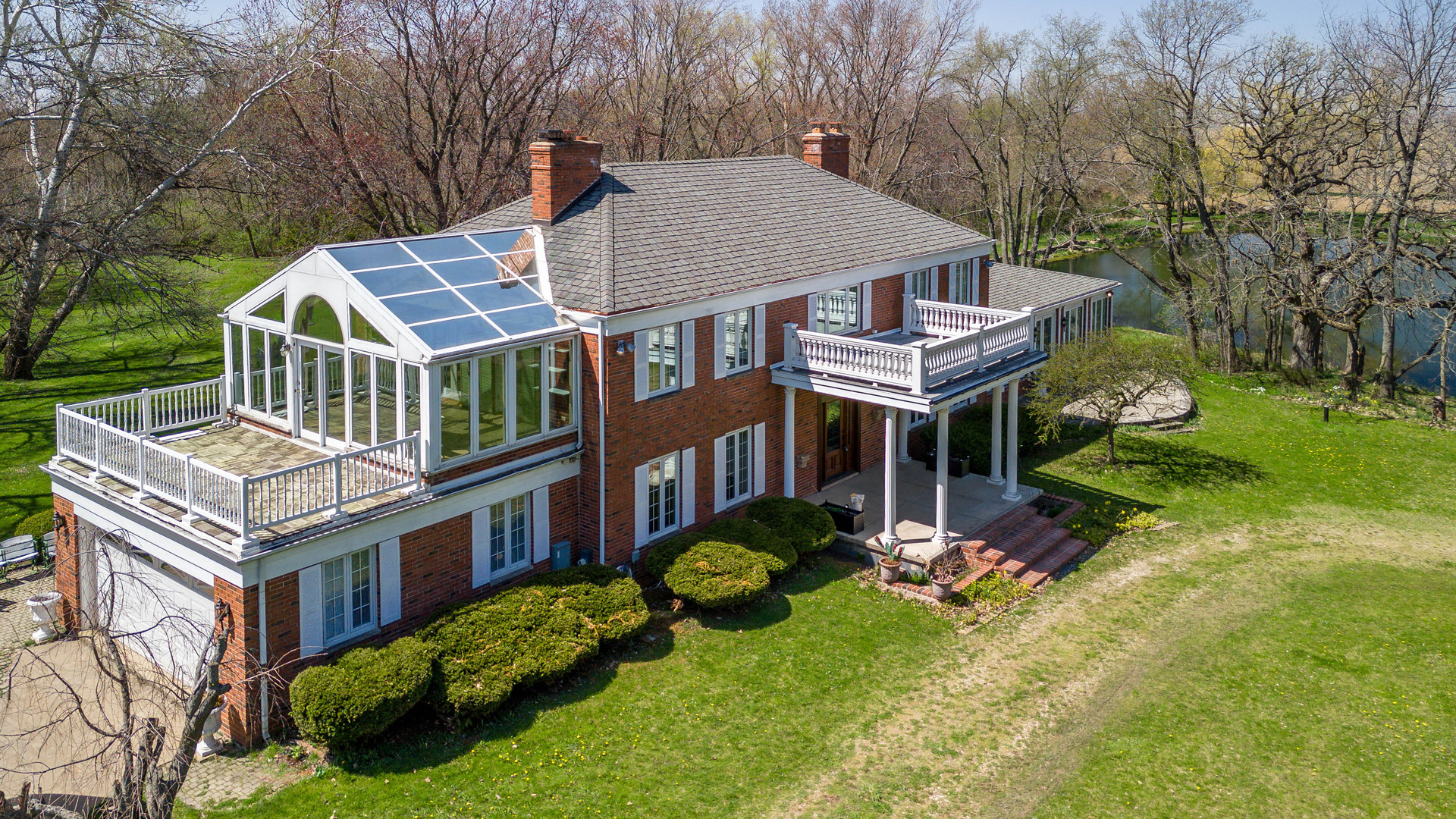 1017 Fisk Road Compton, IL 61318 - Photo 1 of 60 an aerial view of a house with swimming pool and garden