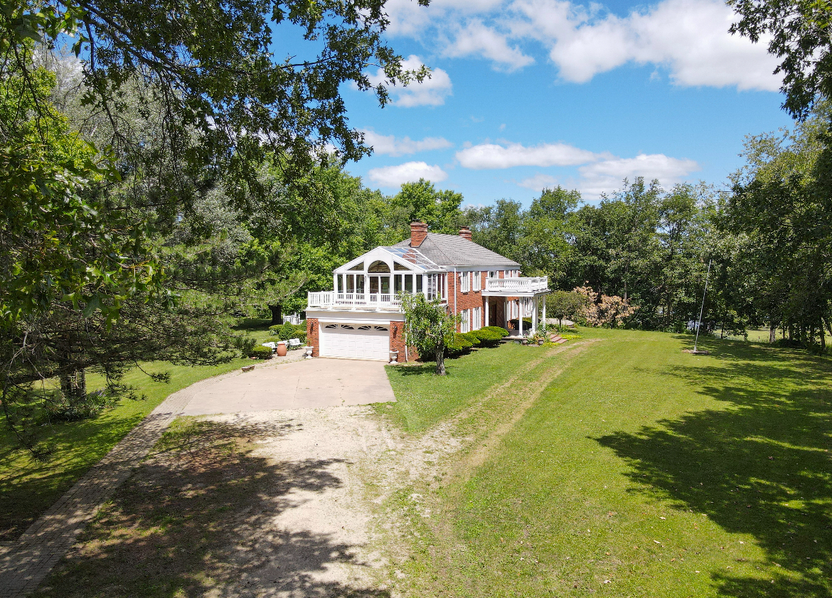 1017 Fisk Road Compton, IL 61318 - Photo 56 of 60 a yellow and red house with a garden